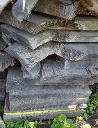 Piles of Walnut & Oak Rough Sawn Lumber