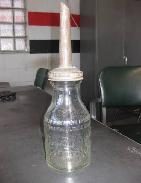 JB Rhodes Co. Embossed Qt. Glass Bottle