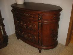 Ornate Carved Oval Top Chest