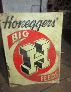 Embossed Honeggers Big Feeds Sign