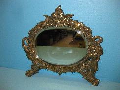 Ornate Brass Figural Mirror