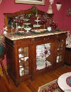   Outstanding Carved Walnut Mirrored Sideboard