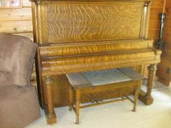   Schumann Flaming Oak Upright Piano